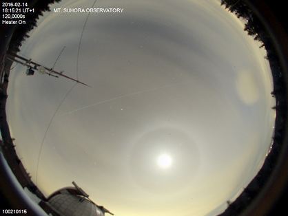 Zdjecie: The International Space Station and a halo around the Moon